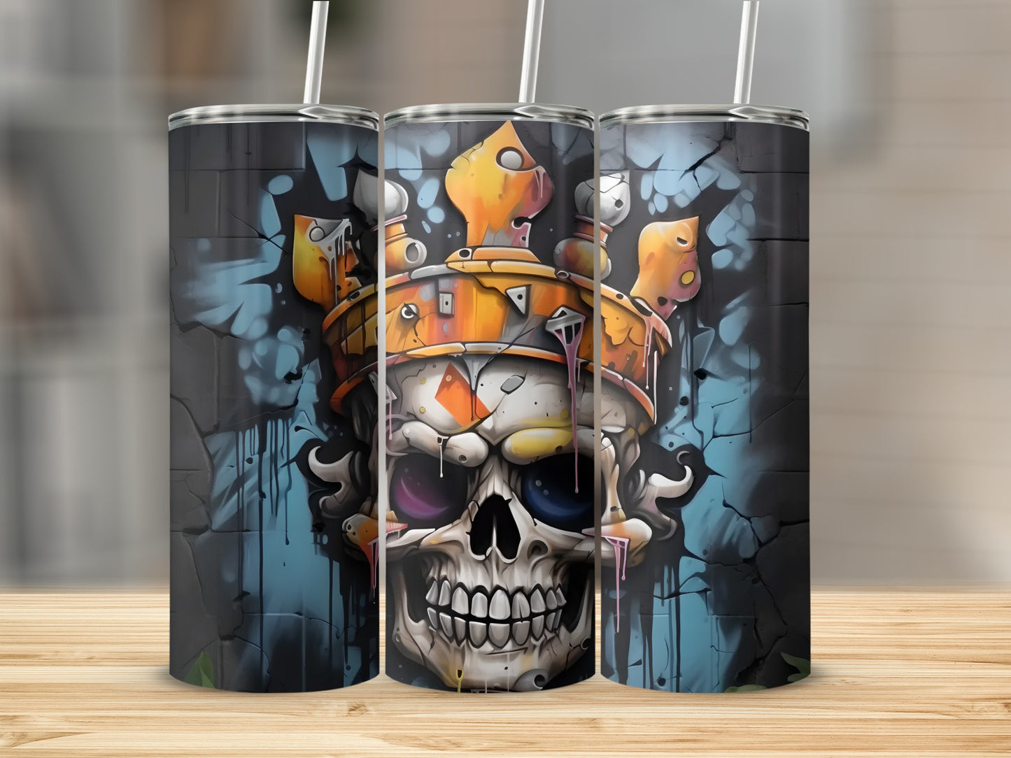 Three tumblers featuring a graffiti-style skull with a crown.