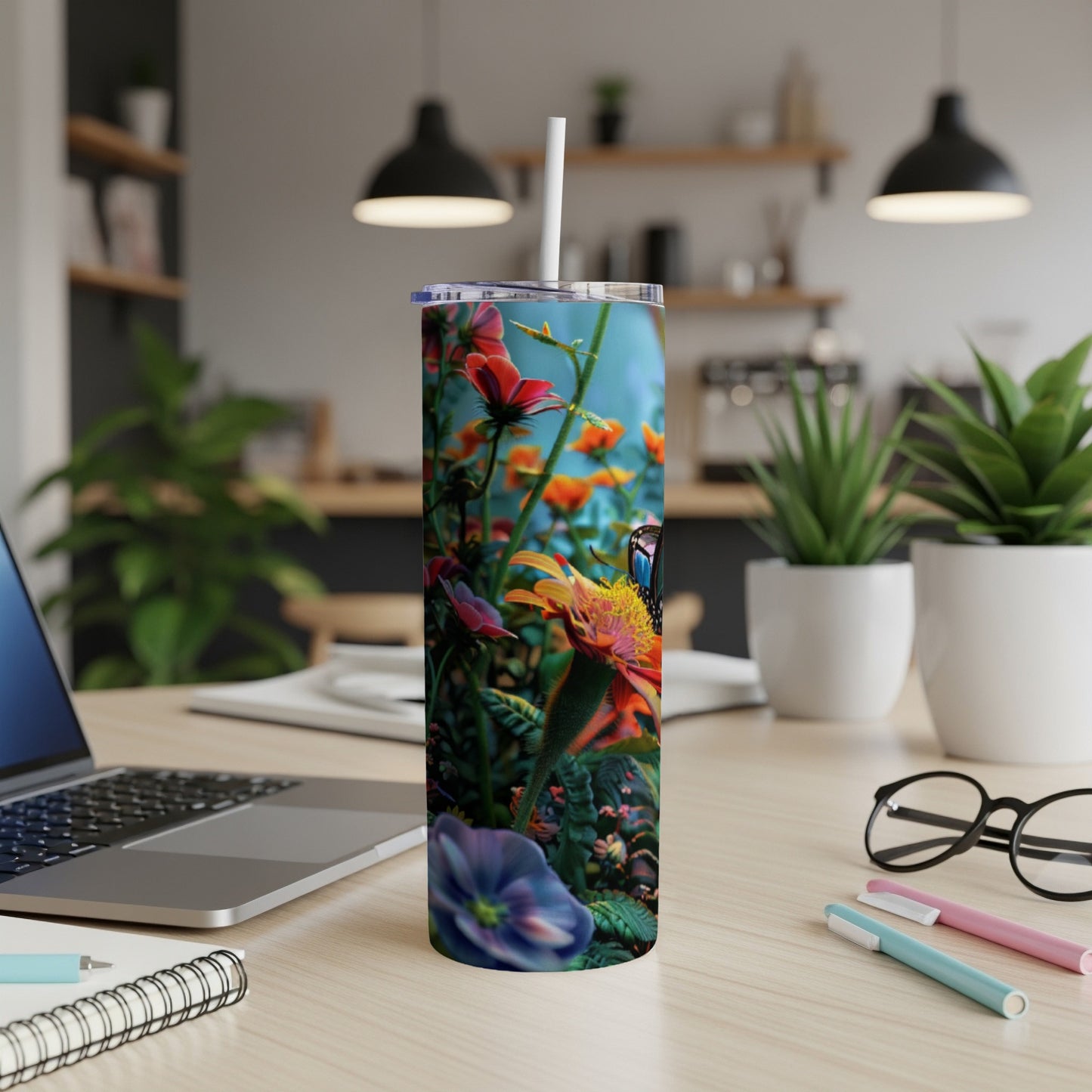 Tumbler featuring a colorful butterfly on a vibrant flower in a garden.