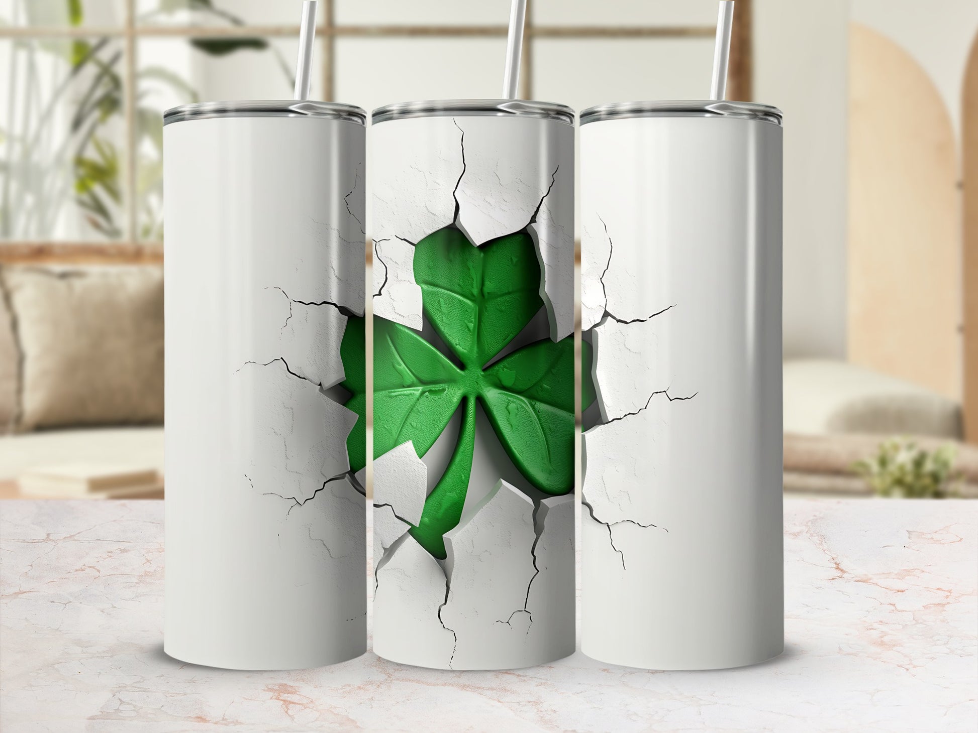 Three white tumblers with a cracked design revealing a green shamrock.