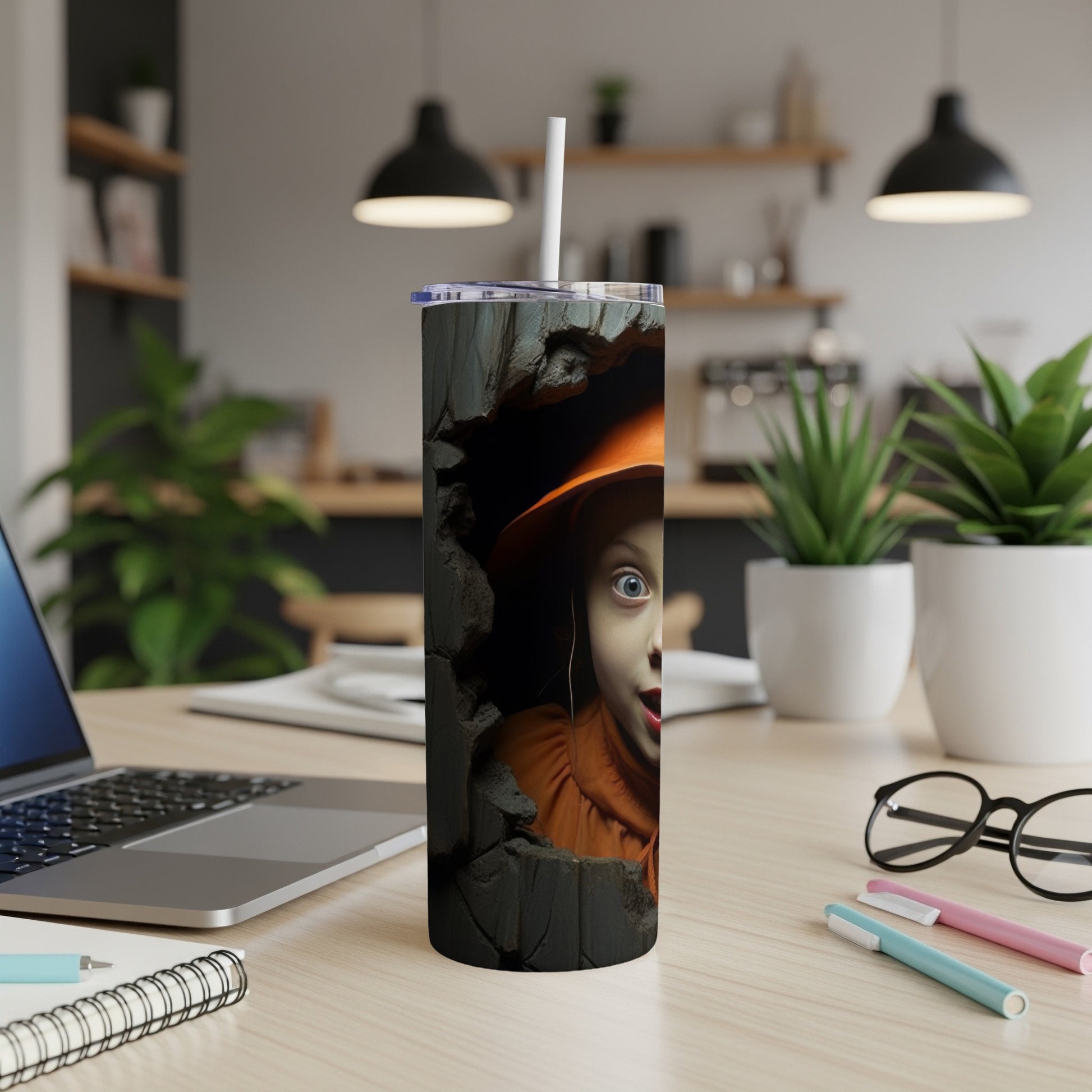 Tumbler with a surprised child in an orange hat peeking through a cracked wall design.