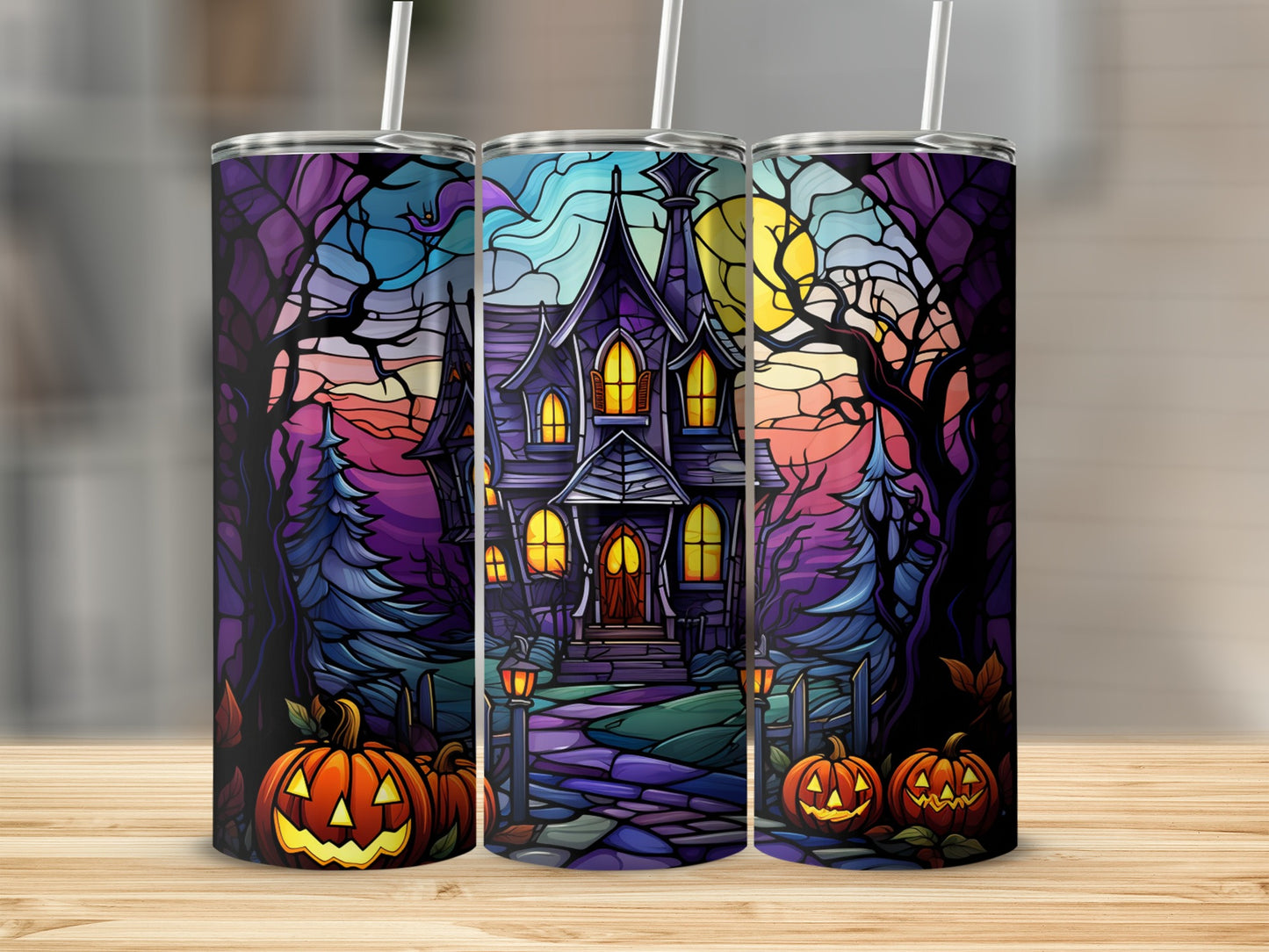 Halloween tumbler with haunted house, pumpkins, and moonlit trees.