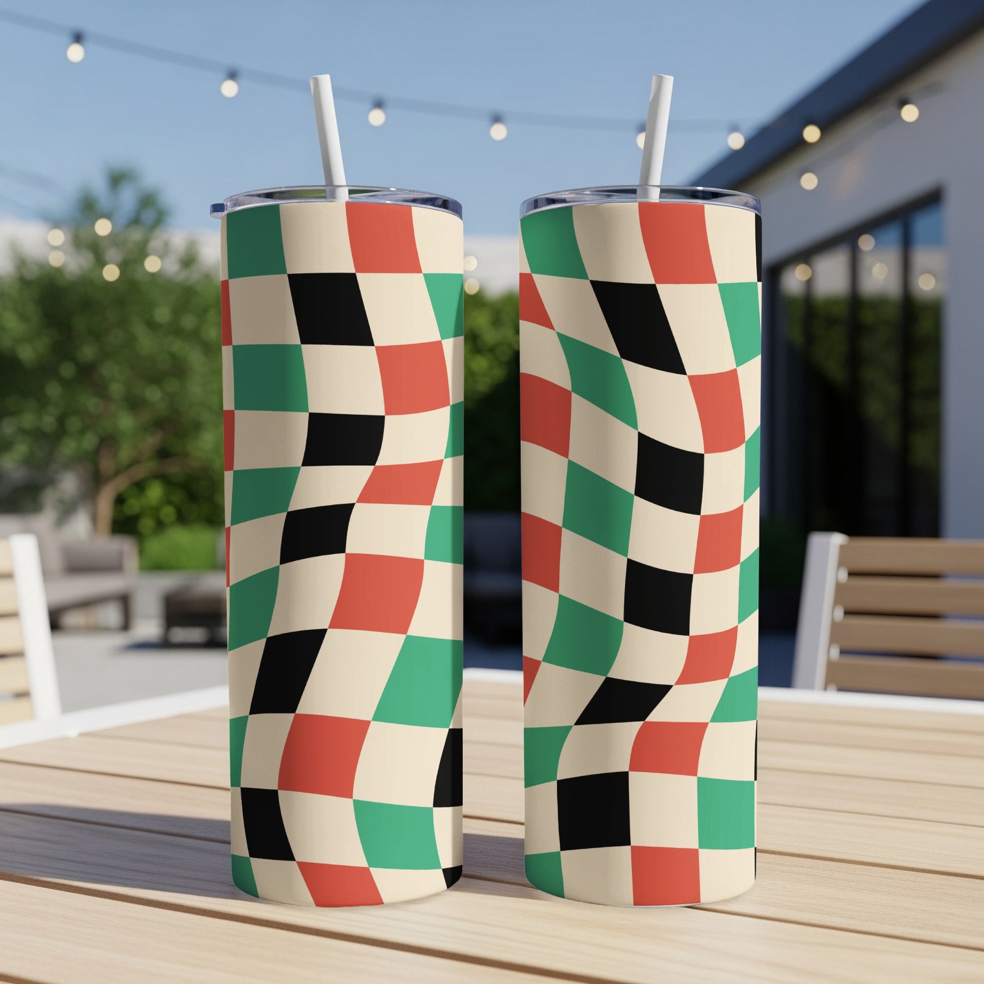 Two tall tumblers with a checkerboard pattern of beige, black, red, and green.