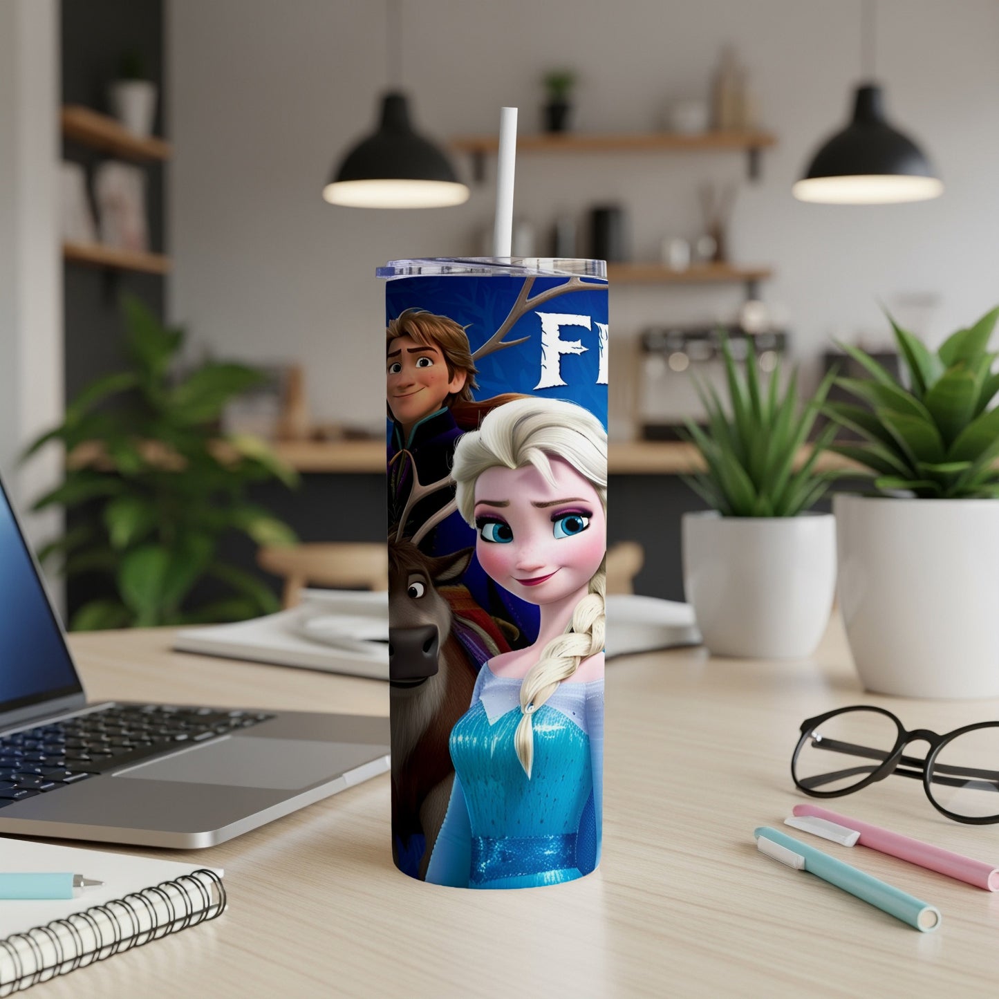Elsa and Kristoff from Frozen on a blue tumbler with a white straw.