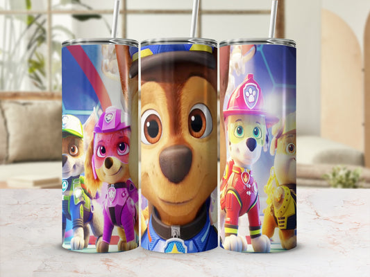 Paw Patrol characters Chase, Skye, and Marshall on a blue and red patterned tumbler.