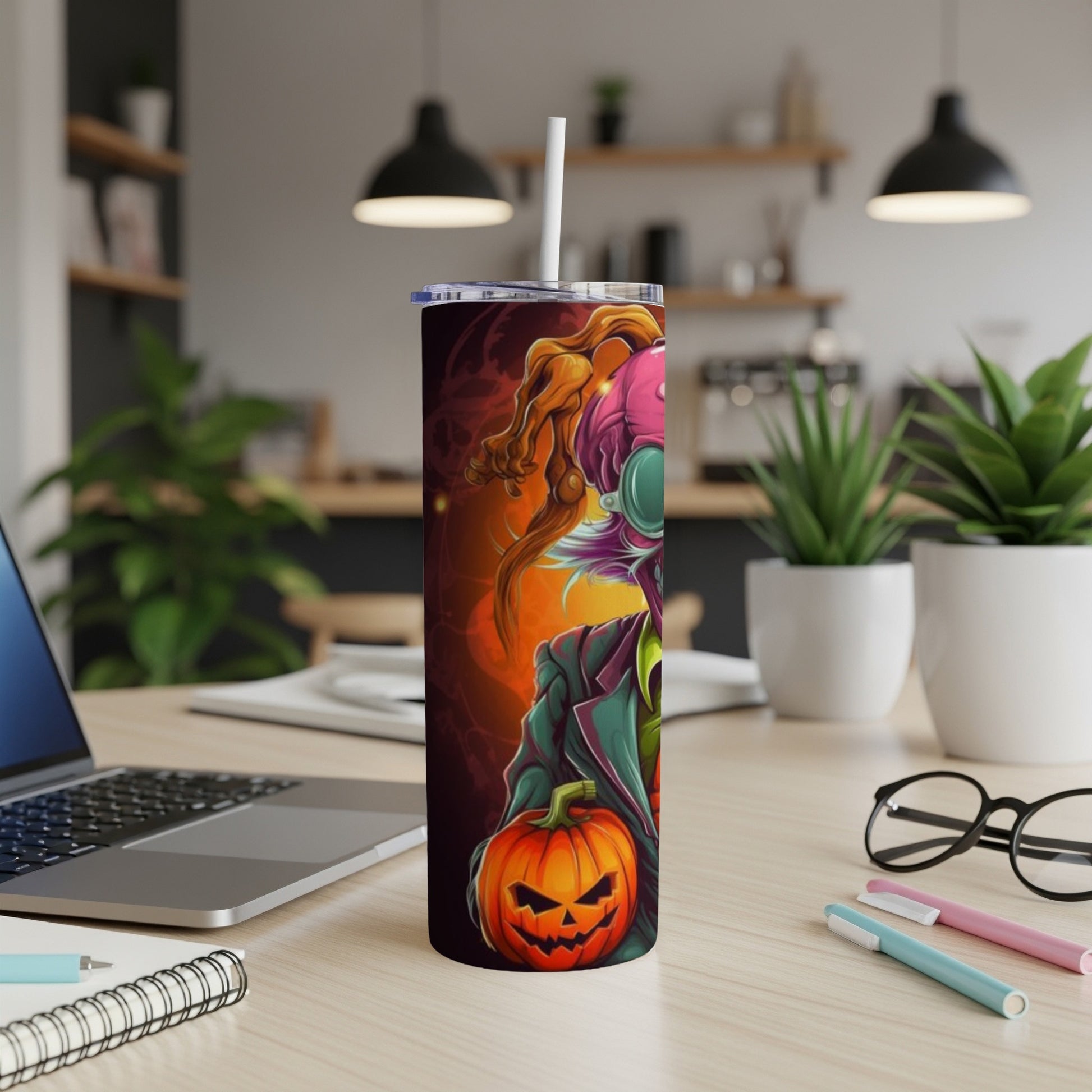 Halloween tumbler with cartoon scarecrow character holding a jack-o'-lantern.