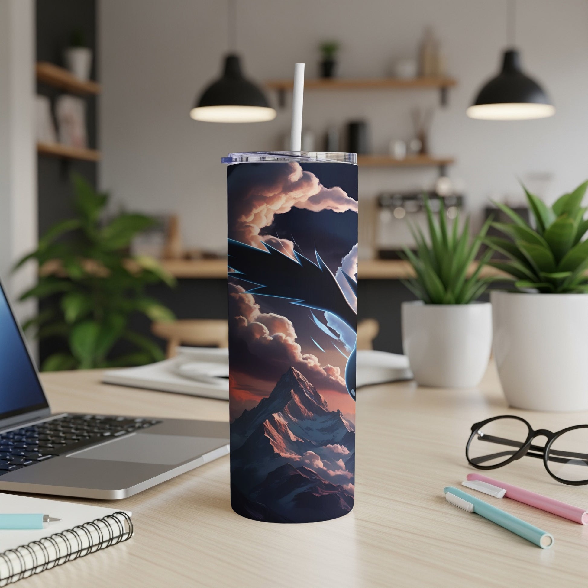 Dragon design on a dark insulated tumbler with mountains and clouds.