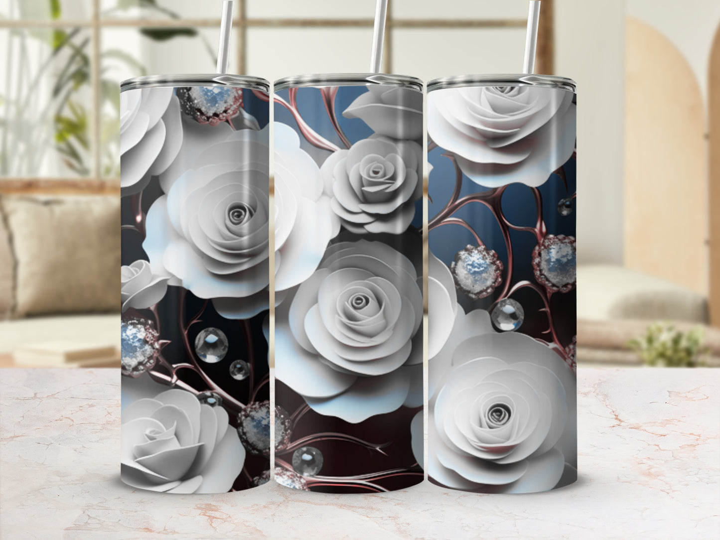Three white rose patterned tumblers with faux gems and straws.