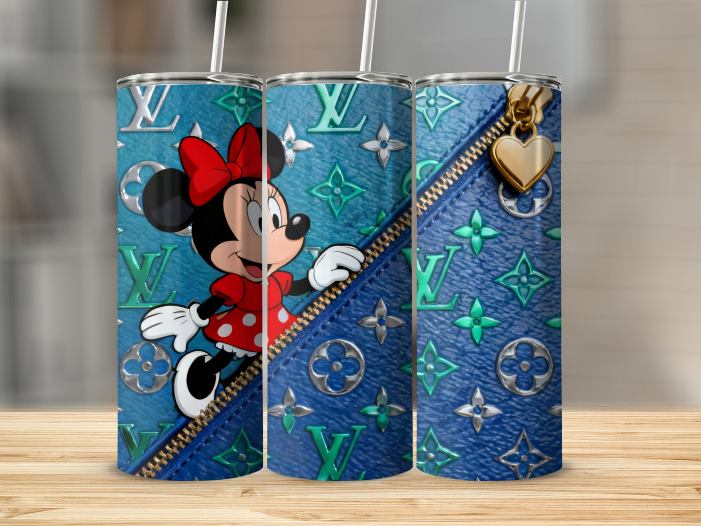 Minnie Mouse on a teal LV pattern tumbler with gold zipper detail.