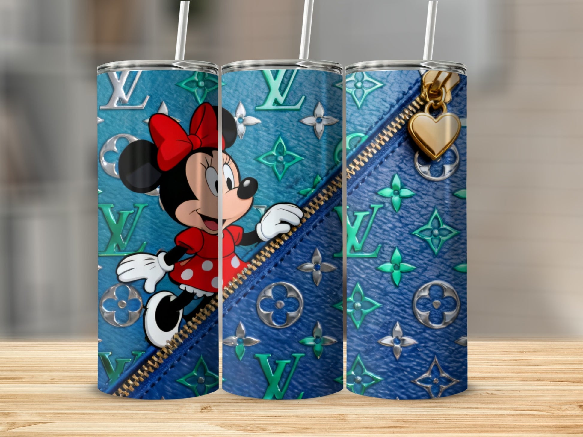 Minnie Mouse on a teal LV pattern tumbler with gold zipper detail.