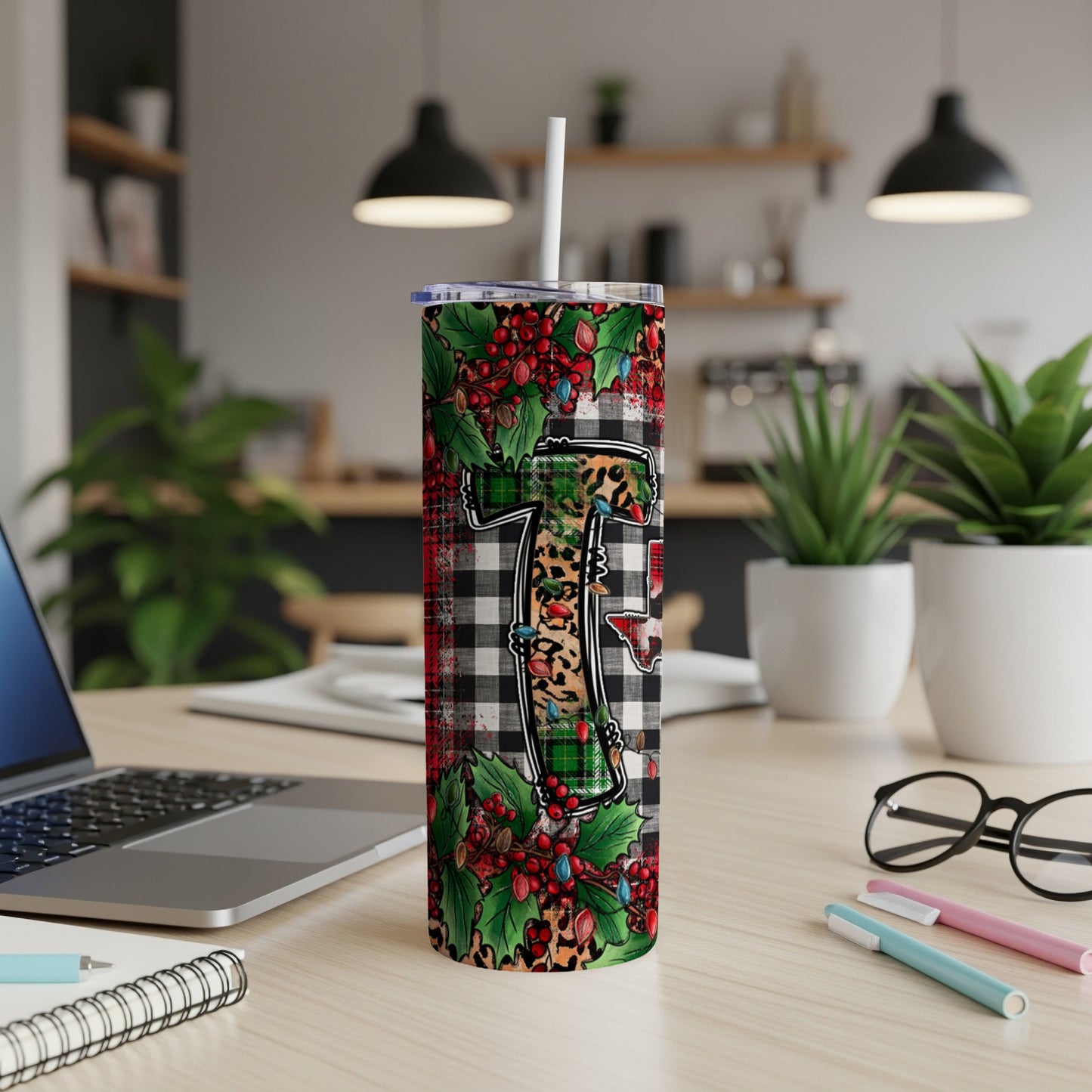Christmas tumbler with buffalo plaid and holly design.
