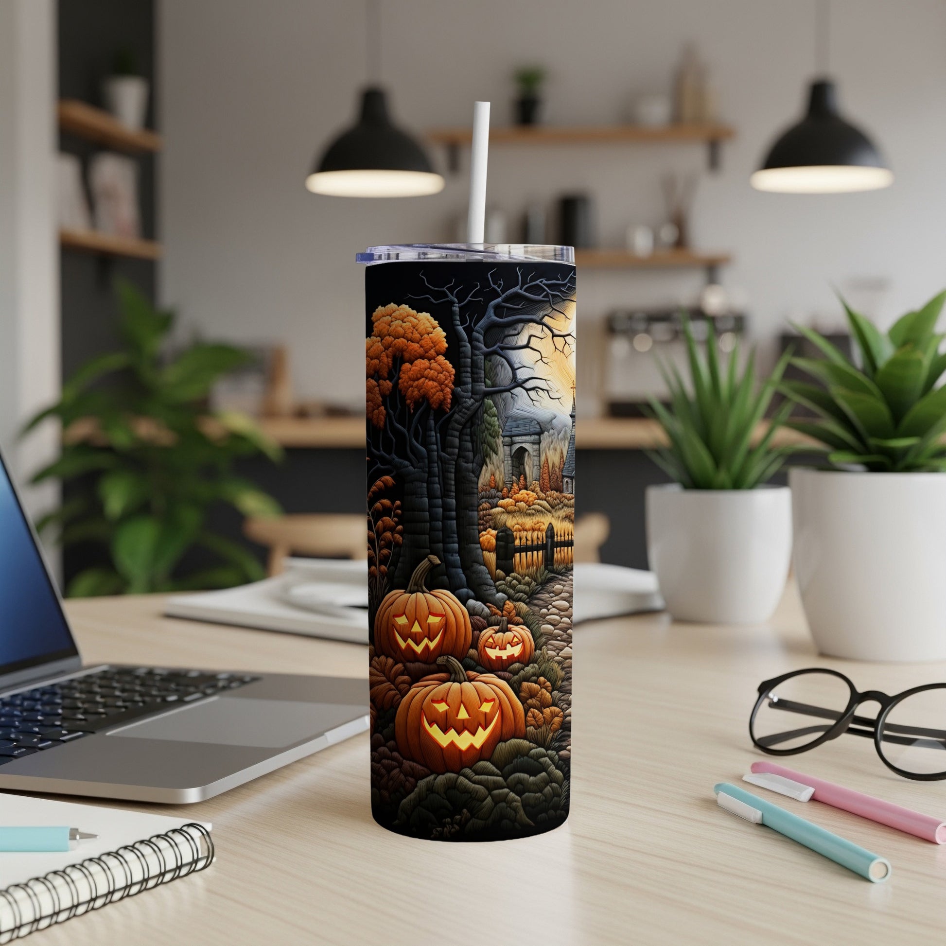 Tumbler with a spooky Halloween scene featuring pumpkins and a haunted forest.
