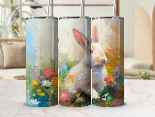 White rabbit surrounded by colorful wildflowers, digital art on tumblers.