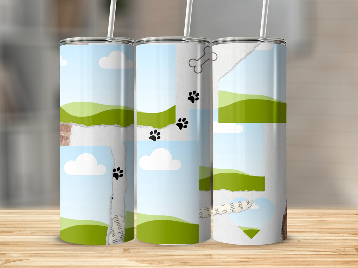 Three tumblers with torn paper graphics of landscapes, paw prints, and a dog bone.