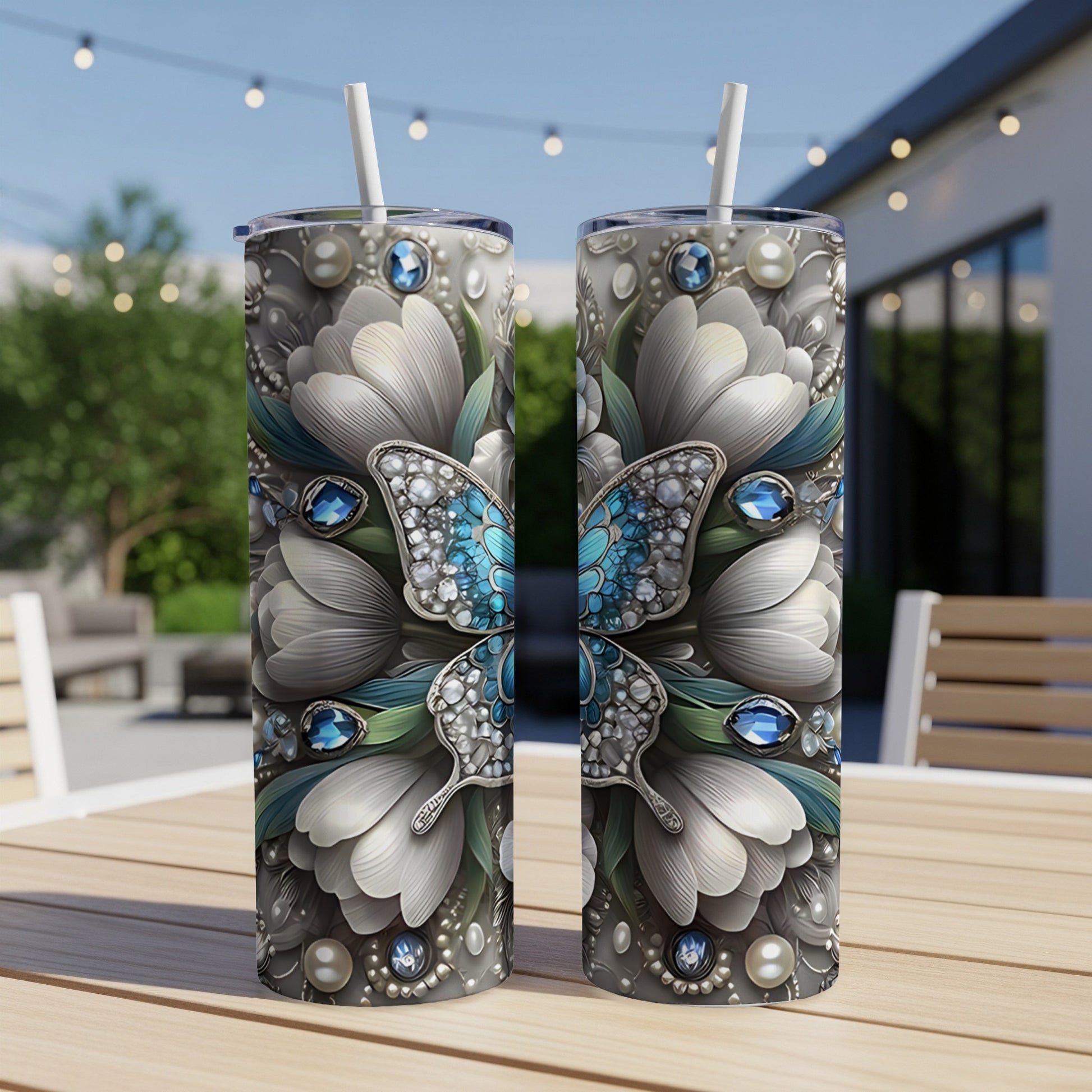 Two tall tumblers decorated with a detailed blue butterfly and floral design.