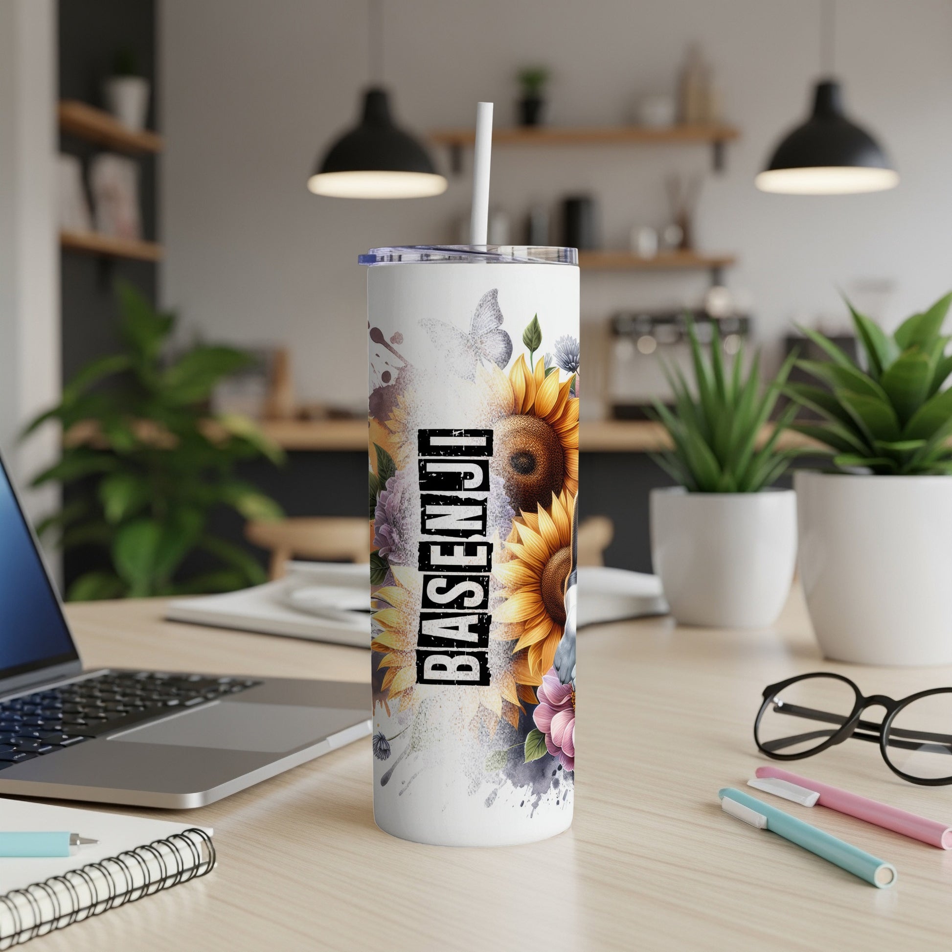 White tumbler with sunflowers and a butterfly, "BASENJI" text.