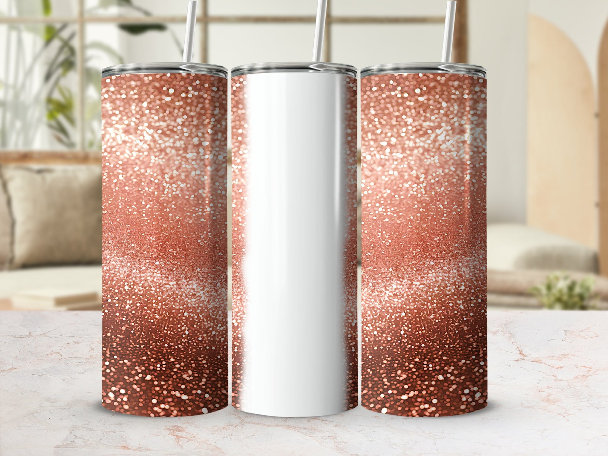 Three rose gold glitter tumblers with straws on a marble surface.