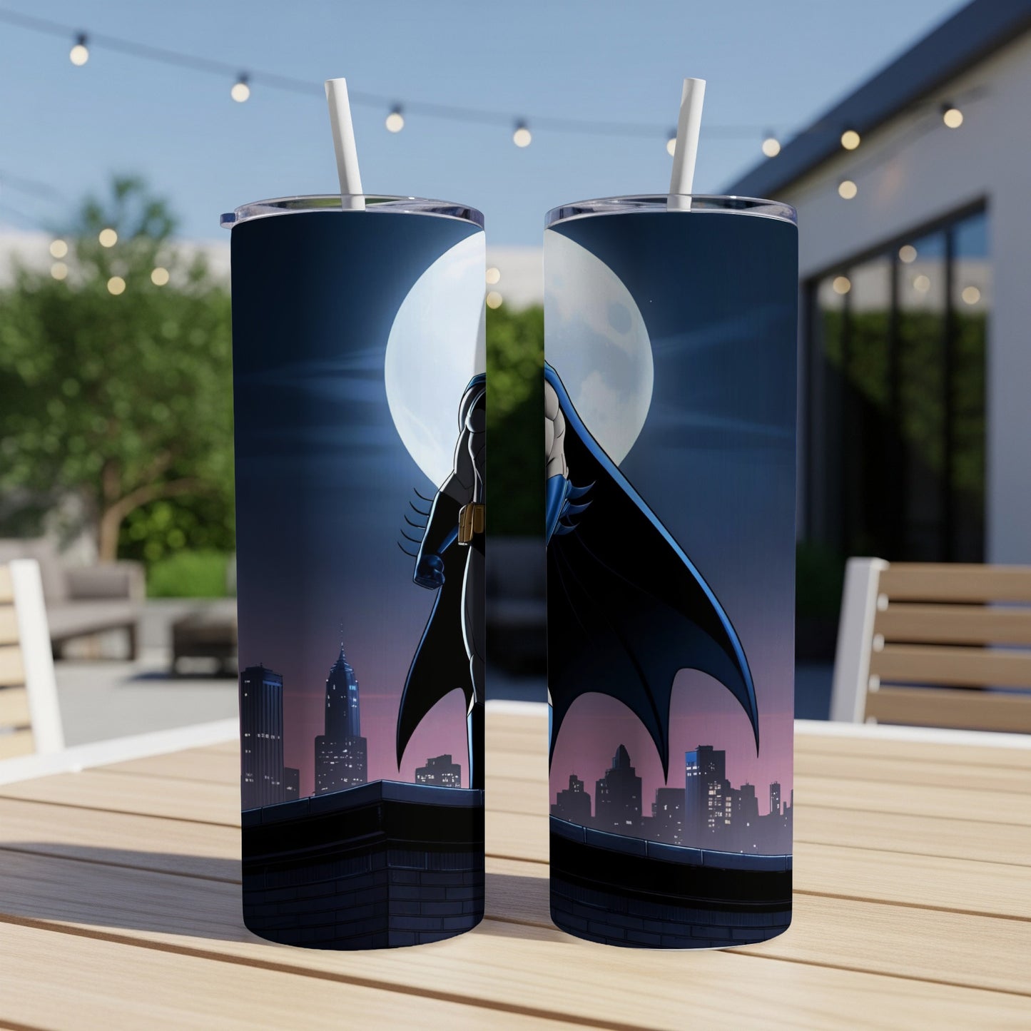 Batman standing on rooftop against city skyline and full moon.