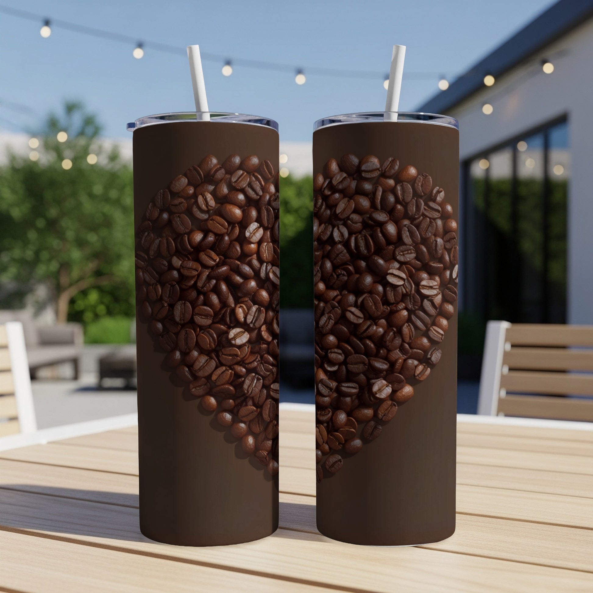 Two tumblers with a heart shape made of coffee beans on a wooden table.