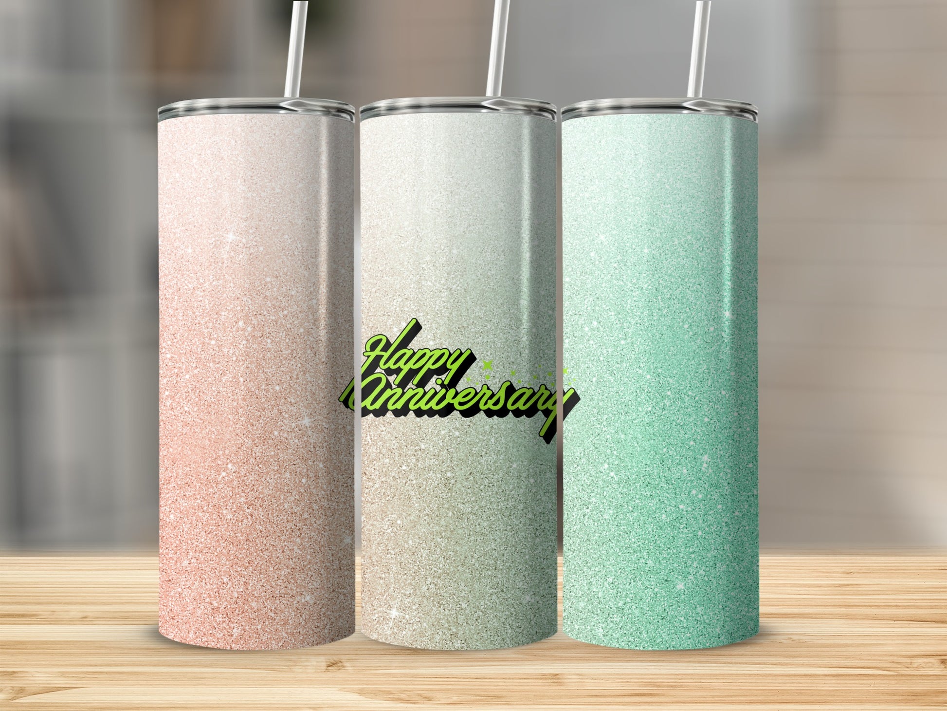Three glitter tumblers with straws: pink, white, and mint green.