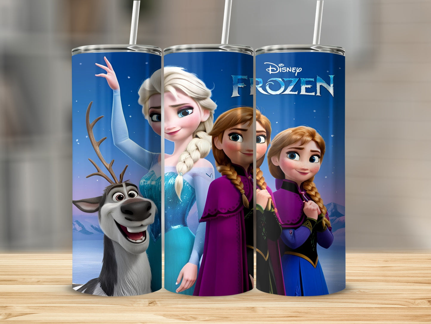 Frozen Elsa, Anna, and Sven on a blue tumbler with straw.