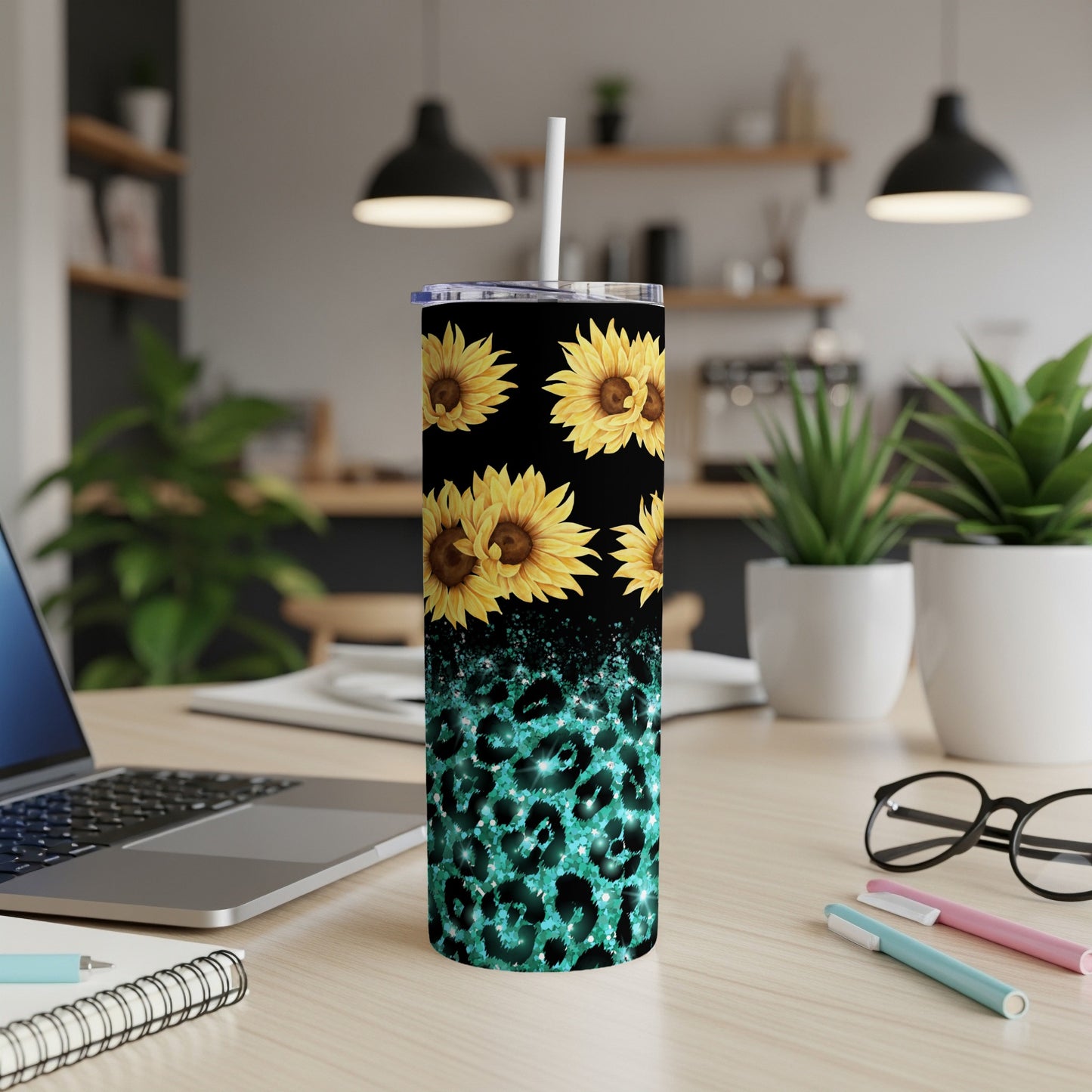 Tall tumbler with sunflowers and teal leopard print pattern.