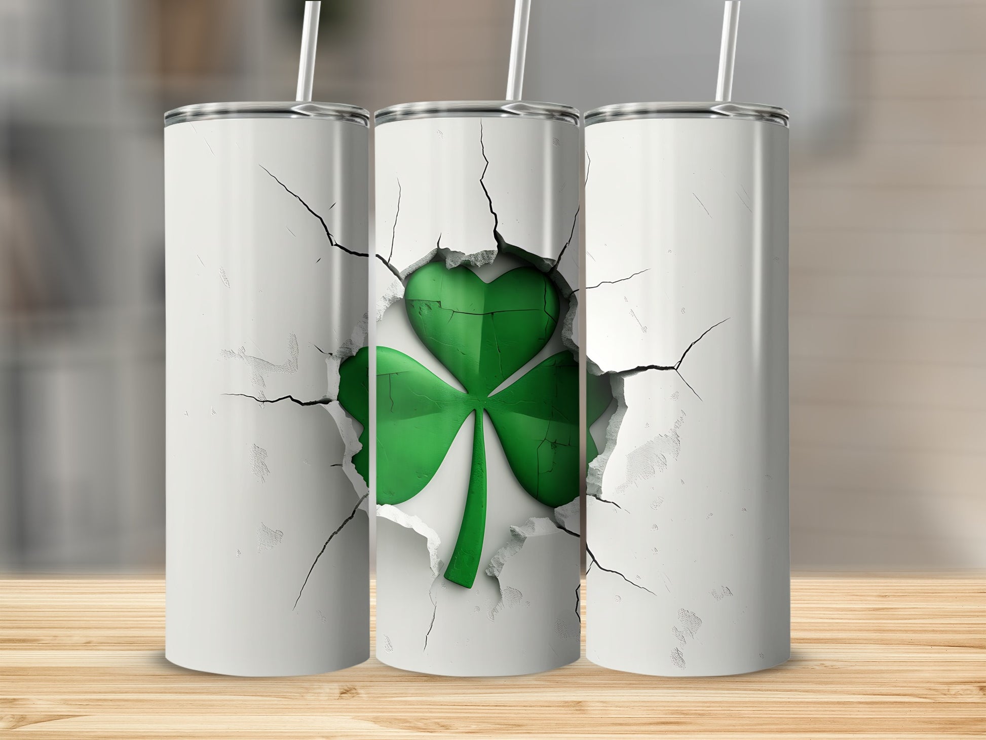 Three white tumblers with a cracked effect revealing a green shamrock.