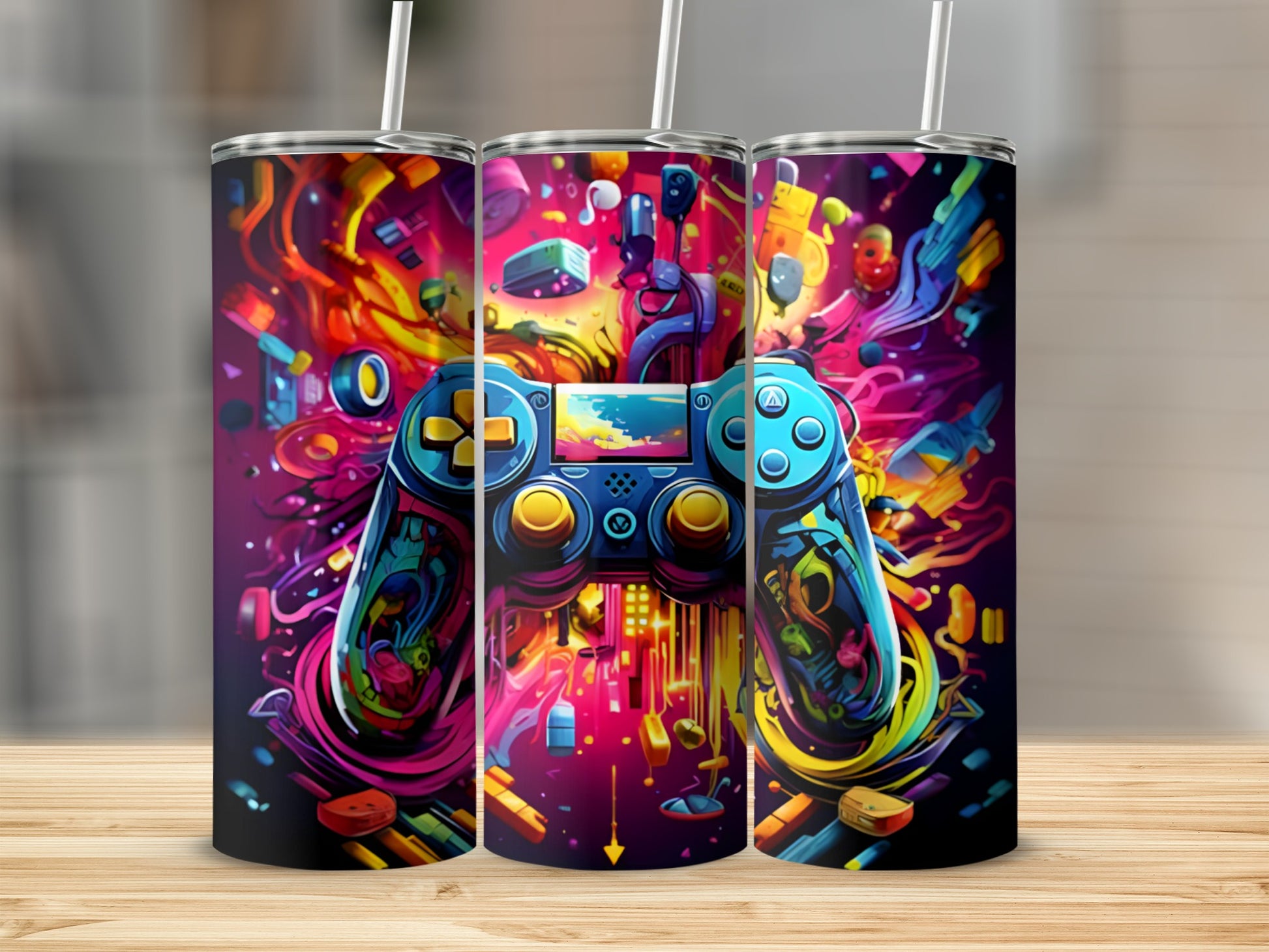Colorful video game controller design on three tumblers.