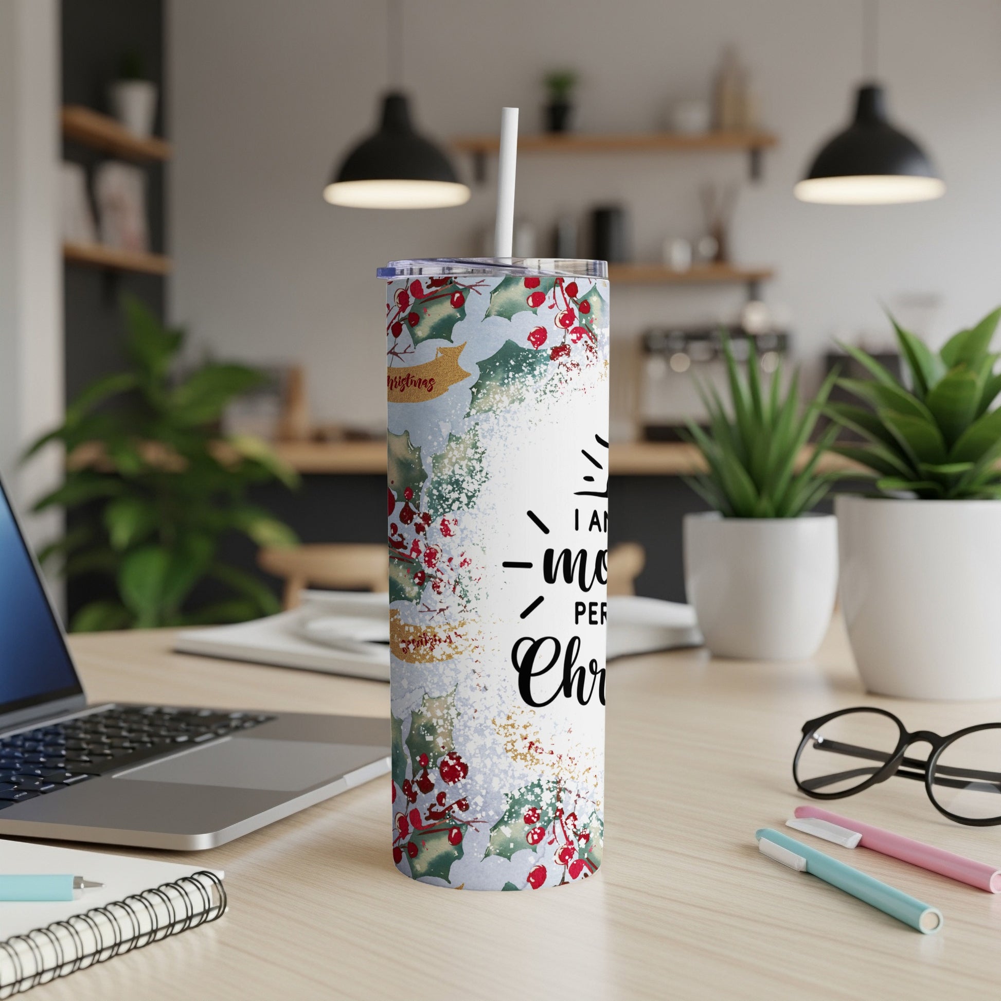 White tumbler with holly berries, snowflakes, and "I wish you a Merry Christmas" text.