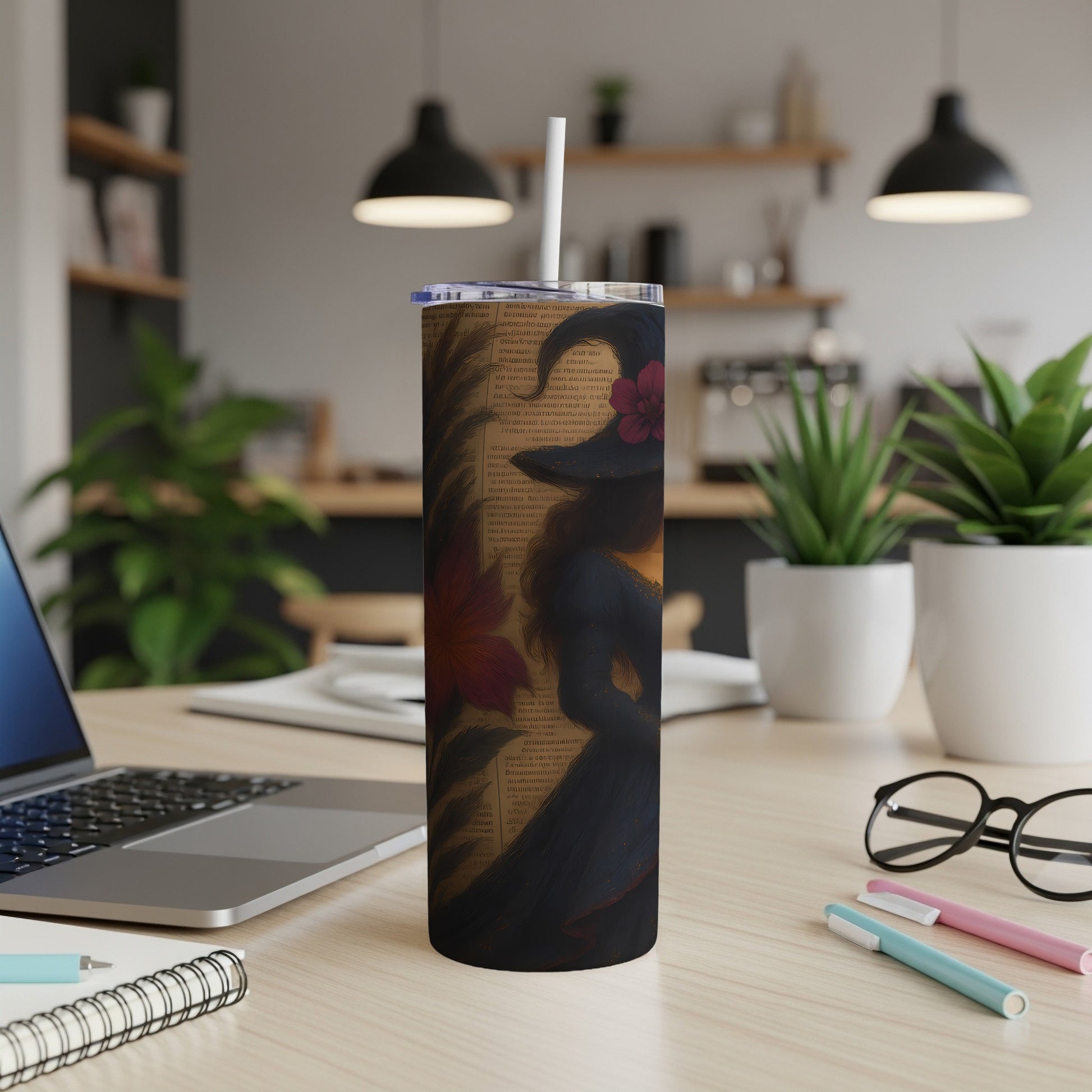 Tumbler with witch silhouette, floral accents, and vintage text design.