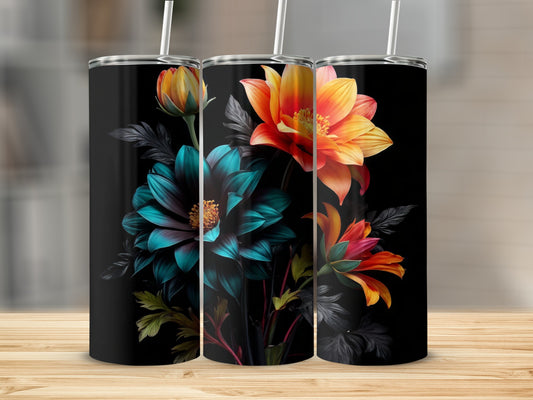 Three black tumblers with floral designs, two showing orange and yellow flowers, one with blue and green.