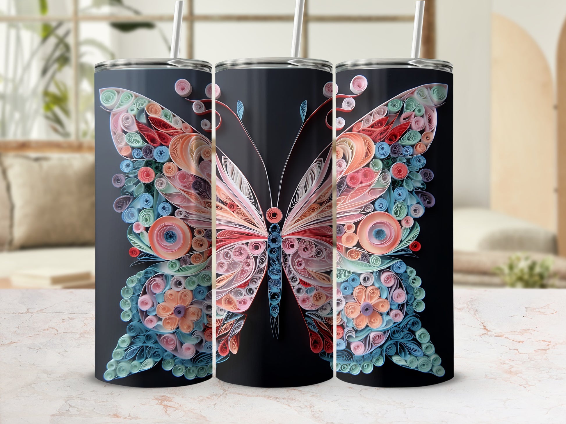 Three tumblers with a colorful quilled butterfly design on a black background.