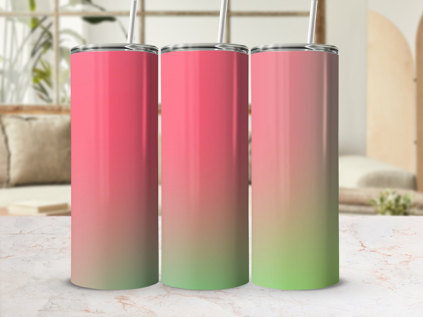 Three tumblers with metallic lids and straws feature a pink to green gradient
