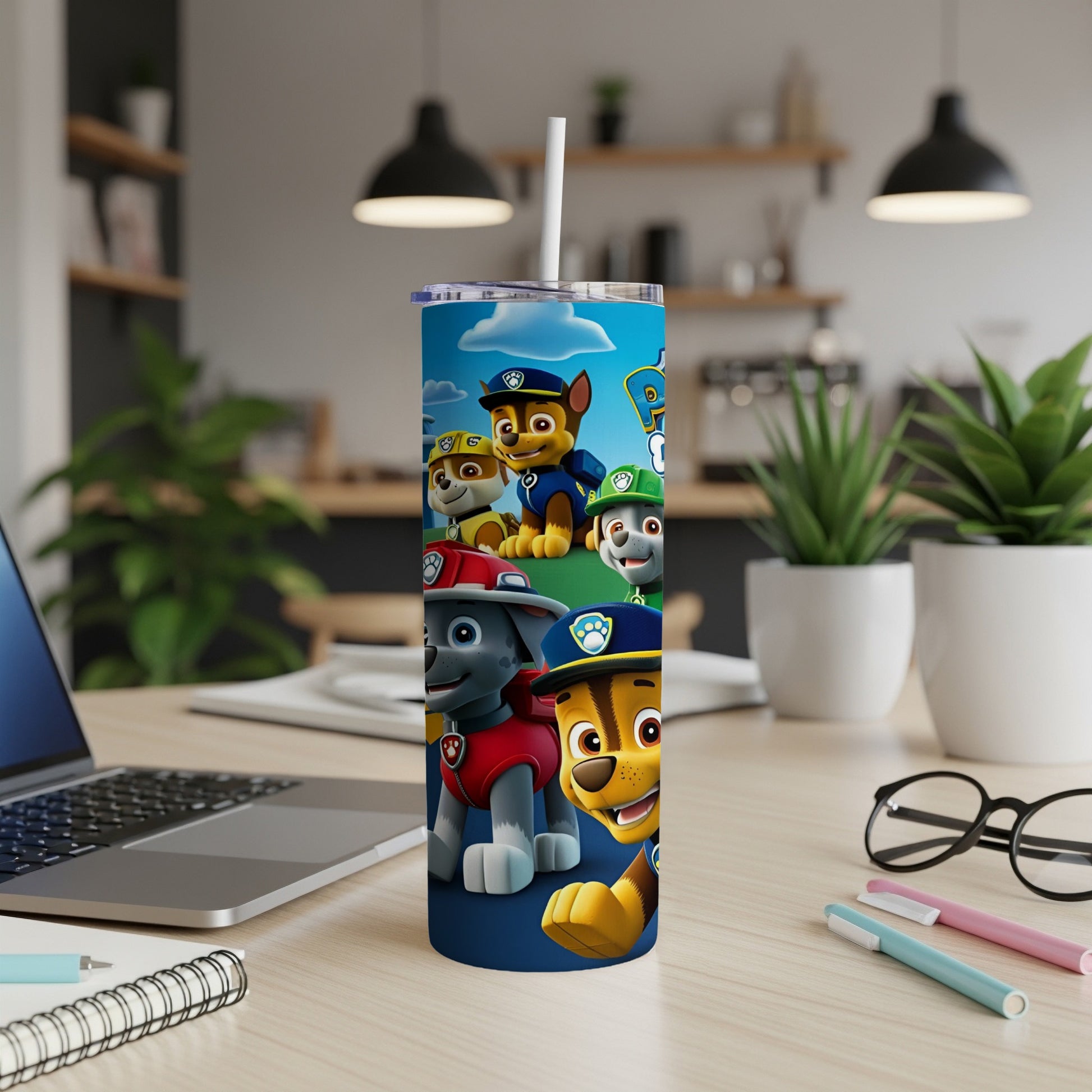 Paw Patrol characters Chase, Marshall, Rubble, and Ryder on a blue patterned tumbler.