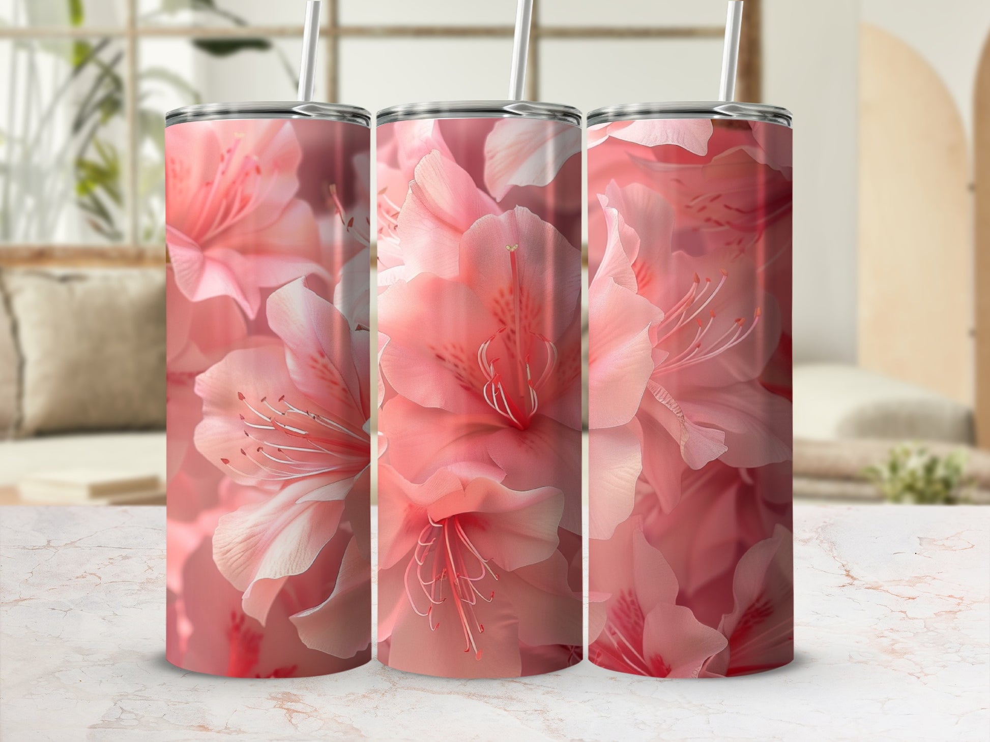 Three tumblers with a close-up floral pattern of soft pink blossoms.