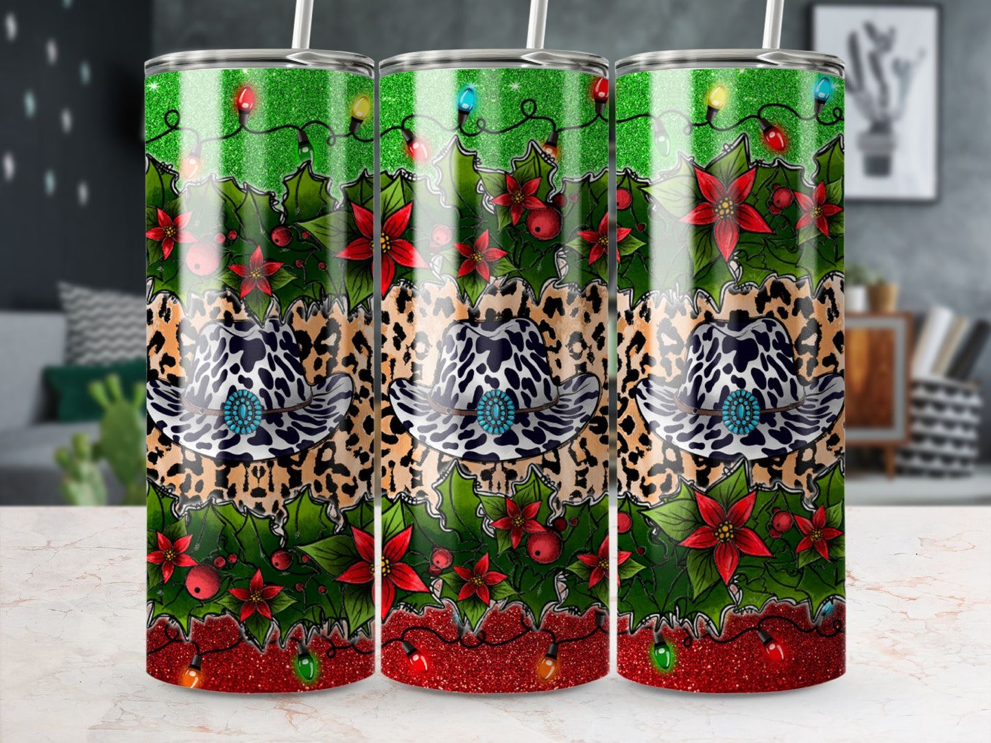 Three tumblers with leopard print, cowboy hat, holly, and Christmas lights.