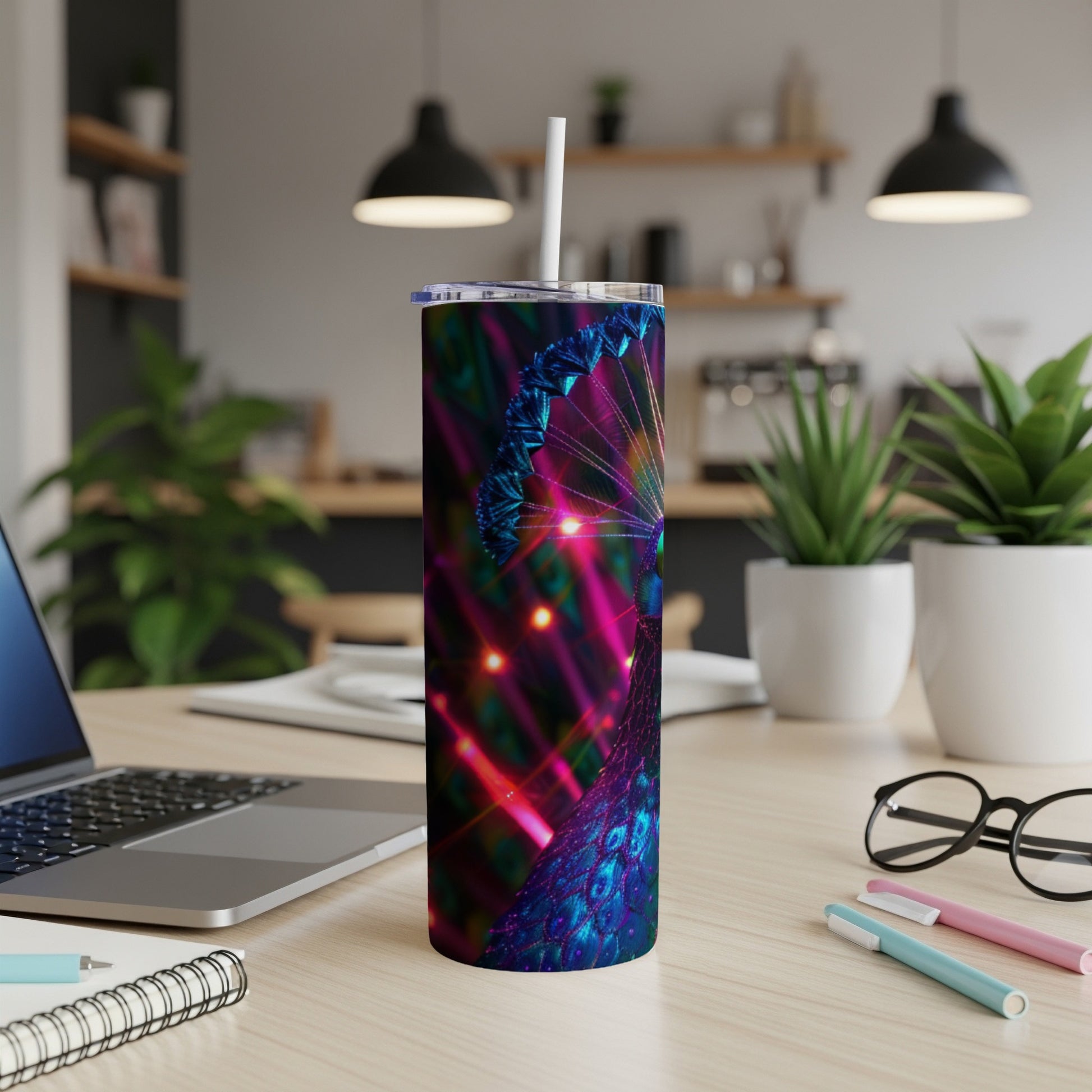 Tumbler with iridescent peacock feather design and bokeh lights.