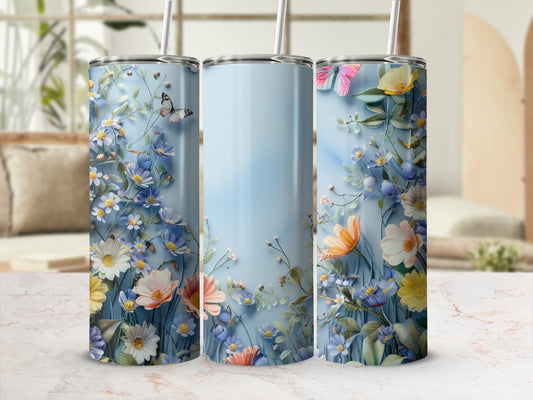 Three tumblers with blue, white, and pink floral and butterfly design.
