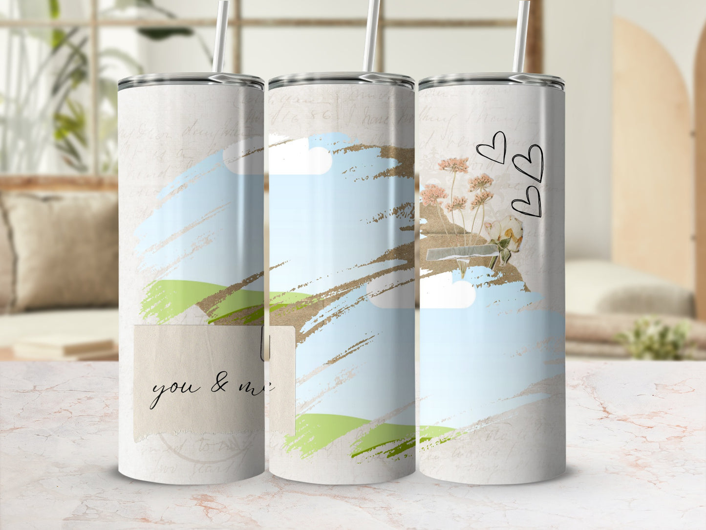 Three tumblers with a landscape design and "you & me" text.