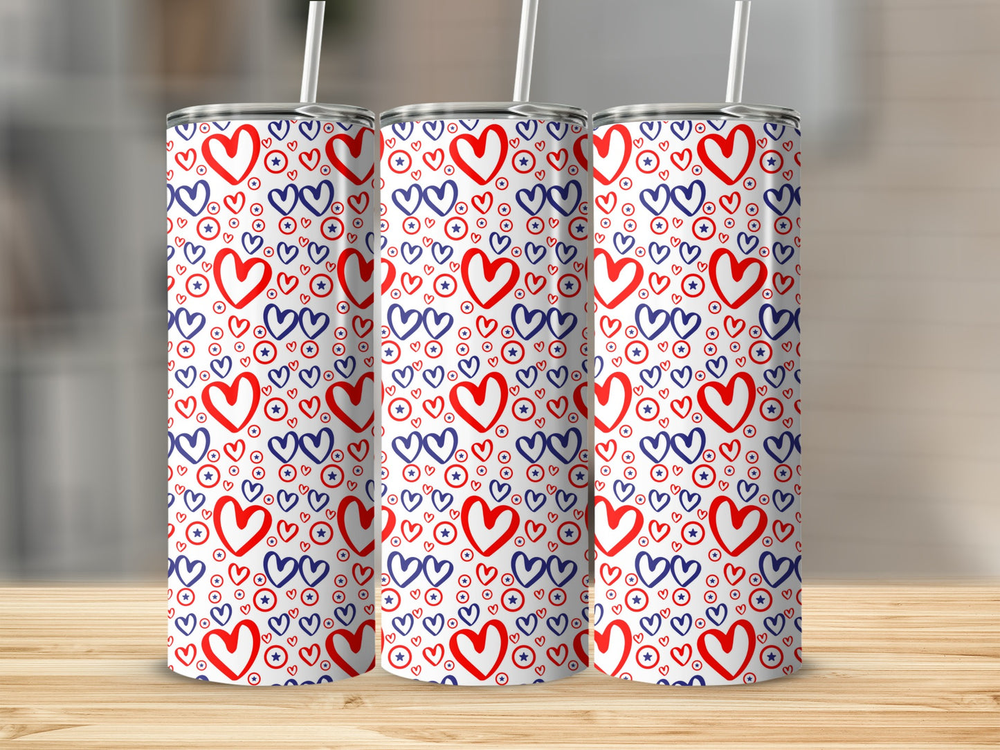 Three tall tumblers with a patriotic red, white, and blue heart and star pattern.