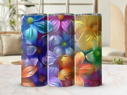 Three tumblers with colorful floral patterns in blues, purples, and oranges.