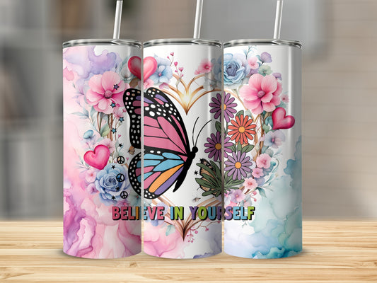 Three tumblers with watercolor floral and butterfly designs, one reads "Believe in yourself."