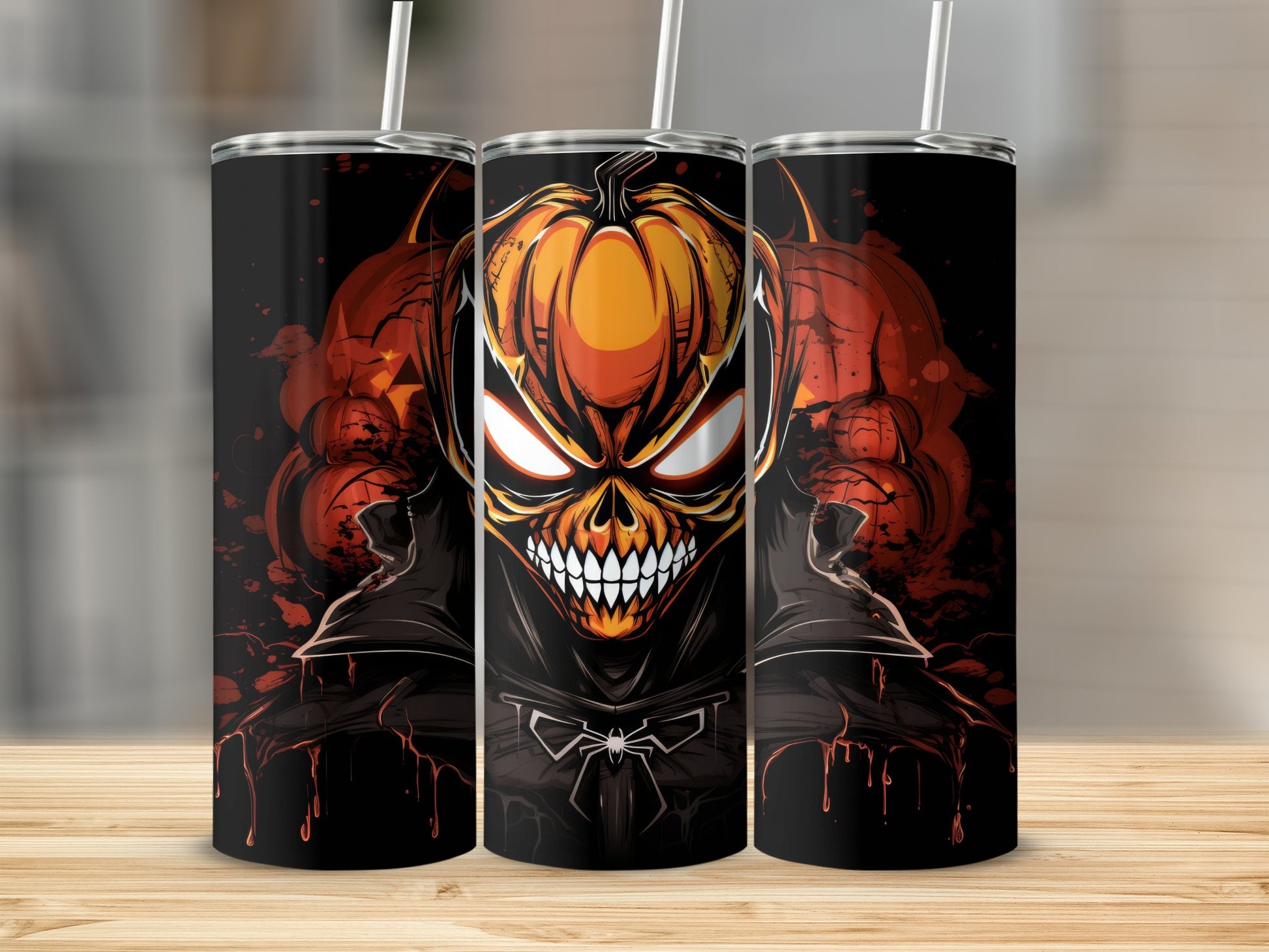Three tumblers with a spooky pumpkin skull design and spider emblem.