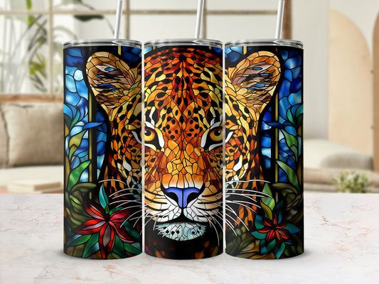 Stained glass leopard face with blue and red floral accents on a tumbler.