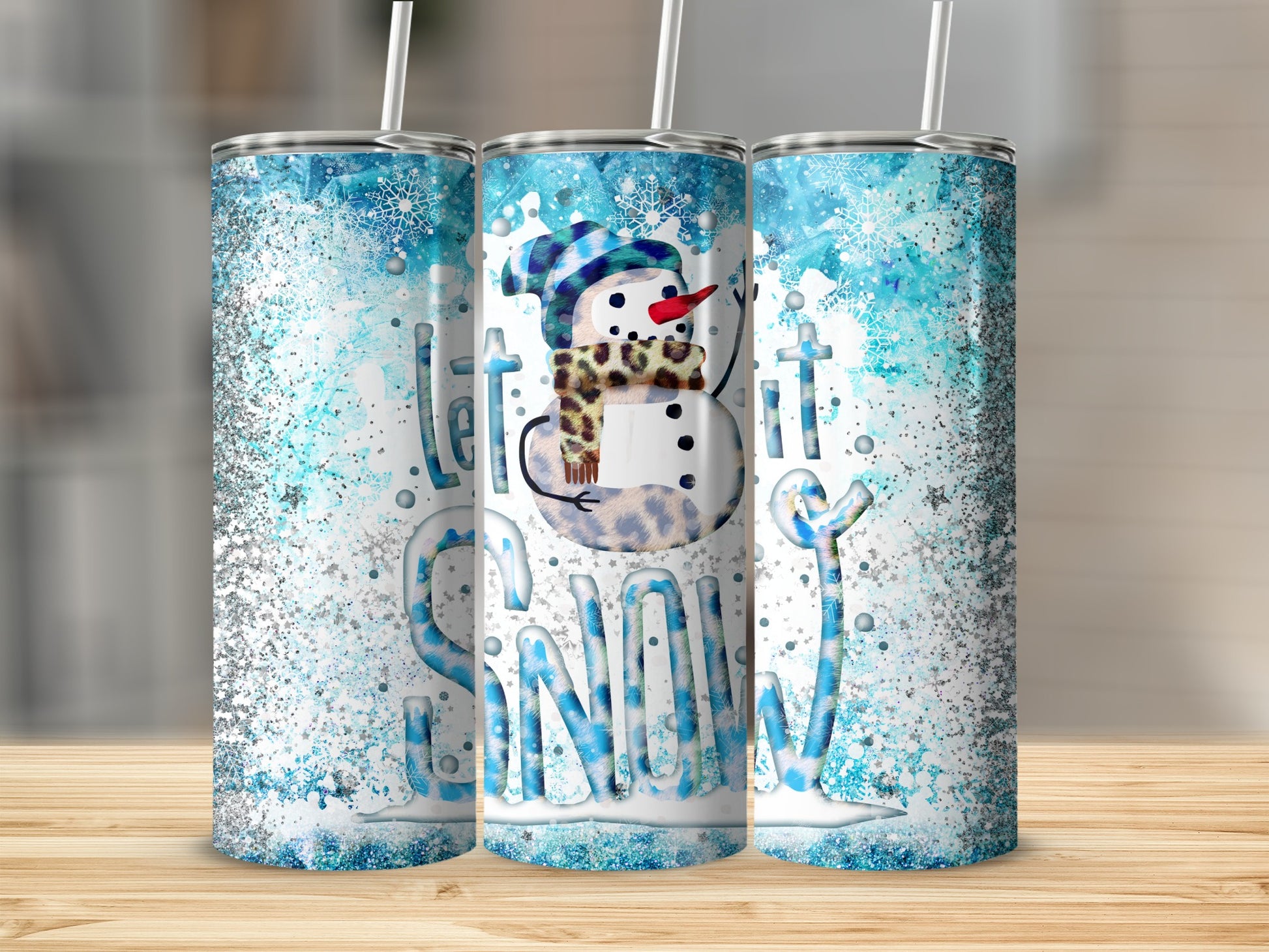 Snowman with "Let it Snow" text and glitter design on three tumblers.