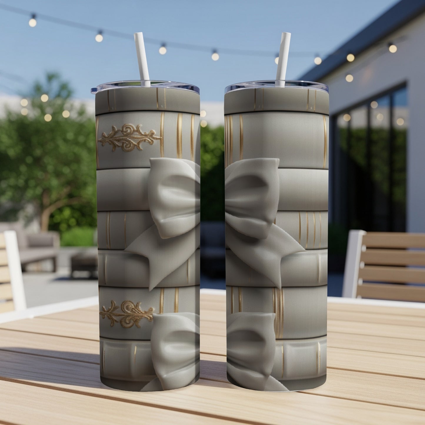 Two tumblers with a stacked book design and gold embellishments.