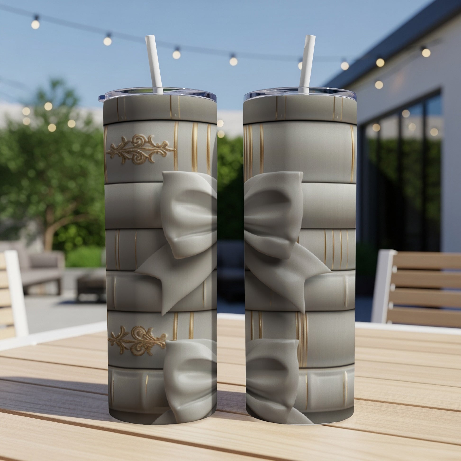 Two tumblers with a stacked book design and gold embellishments.