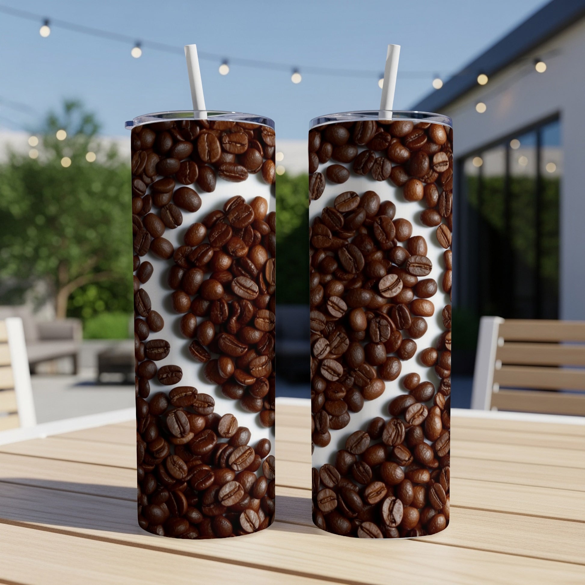 Two tall tumblers with a heart pattern made of coffee beans.