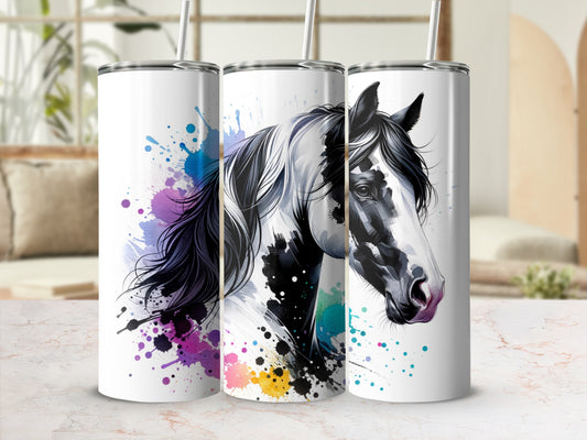 Tumbler with black and white horse head art and colorful paint splatters.