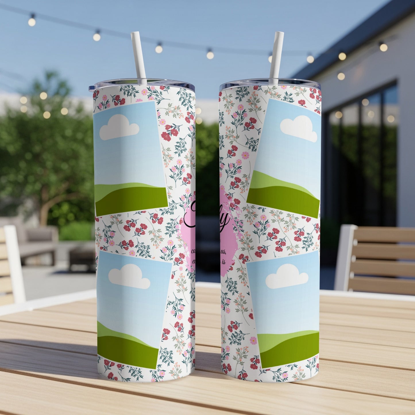 Floral tumbler with landscape and cloud graphics and "Family" text.