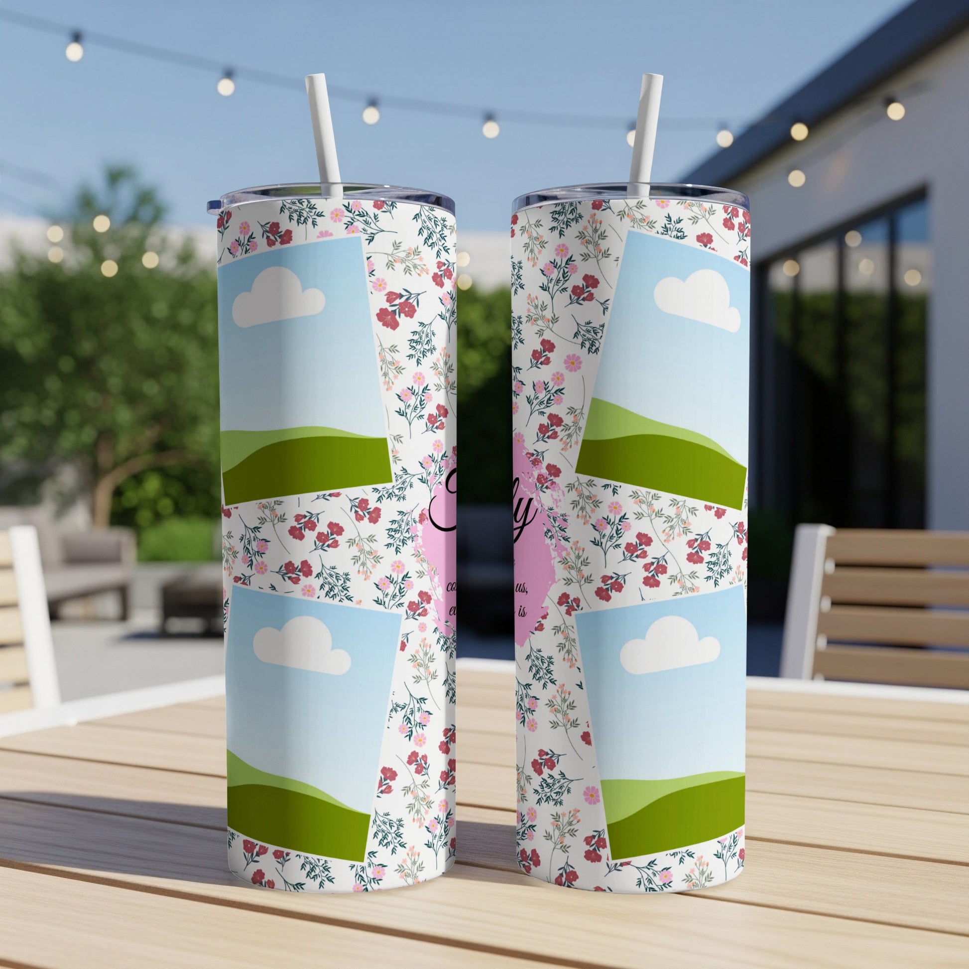 Floral tumbler with landscape and cloud graphics and "Family" text.
